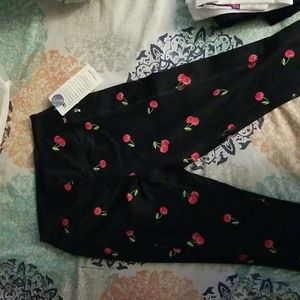 Pink ultimate leggings sz Large Black with cherries all over.